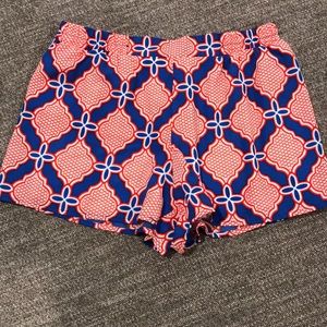Red and blue patterned shorts. Size Med with tags
